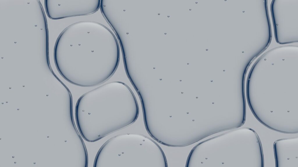 Abstract pattern of liquid bubbles with small particles.