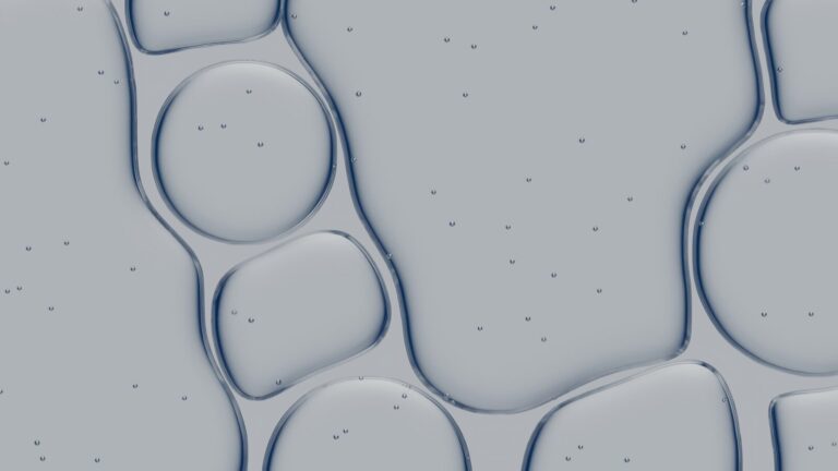 Abstract pattern of liquid bubbles with small particles.